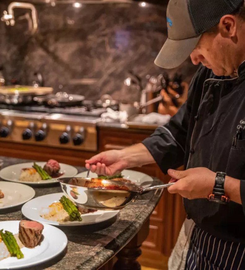 Private chef preparing an in-villa dinner